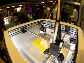 A 3D printer is displayed in Paris in 2013. The pandemic has demonstrated the exciting potential of 3D printing in responding to emergency situations, Keroles B. Riad says.