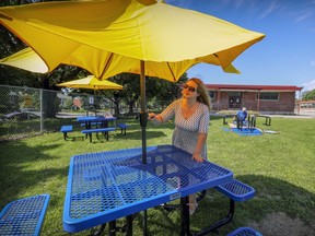 Lester B. Pearson School Board art therapist Melanie Forest and her husband Michael Louvaris put together tables while creating an outdoor classroom outside Maple Grove elementary school in the Lachine borough of Montreal Wednesday August 12, 2020. Forest got a government grant to purchase the park-grade tables. Maximizing outdoor time is one of the safety measures being advocated by a group of parents at Westpark school.