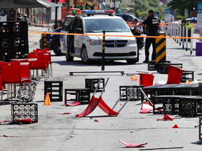 Tables and chairs are scattered on Ste.-Catherine St. at Crescent St. on Saturday, August 8, 2020, after a motorist drove his car through a restaurant terrace on the street that is closed to vehicles on weekends.