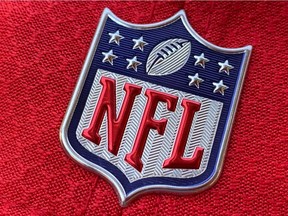 In this file photo taken on July 21, 2020 the official NFL logo is seen on the back of a hat in Los Angeles. - A half-dozen NFL clubs experienced COVID-19 test result irregularities from the same New Jersey laboratory, prompting teams to change or cancel practice sessions on August 23, 2020 as a precaution. The league announced several positive results for multiple clubs were returned from the same lab Saturday, causing questions given a positivity rate below 1% from more than 100,000 coronavirus tests conducted since the start of NFL training camps. (Photo by Chris DELMAS / AFP)
