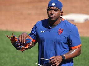 New York Mets outfielder Yoenis Cespedes walks across the infield during workouts at Citi Field.