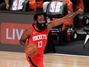 July 31, 2020; Lake Buena Vista, USA;   James Harden #13 of the Houston Rockets dribbles during the first half against the Dallas Mavericks at The Arena at ESPN Wide World Of Sports Complex on July 31, 2020 in Lake Buena Vista, Florida.