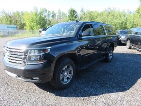 A 2018 Chevy Suburban is listed for sale on the GC Surplus website.