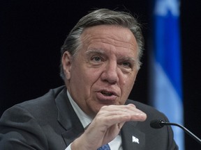 "We're following certain neighbourhoods closely, among them Dorval, Lachine and LaSalle, where there are more cases," says Premier François Legault, seen in a file photo.