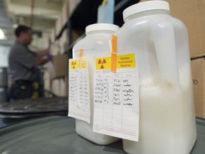 A man inspects drums containing radioactive material at a storage facility at the University of Toronto in 2007. Various precautions are taken to prevent radioactive material from falling into the wrong hands.