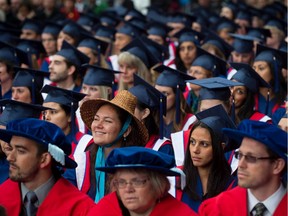 A Simon Fraser University student wears a First Nations Coast Salish woven cedar hat as she and other students wait to receive their degrees during the fall convocation ceremony at the university in Burnaby, B.C., on Friday October 11, 2013. All too often, it's assumed "that Indigenous people aren’t supposed to go off and become doctors, teachers, lawyers or engineers. We aren’t supposed to exhibit the qualities that would allow us to do so," Tomas Jirousek writes.