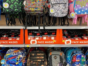 Face masks are shown for sale with back packs and back-to-school supplies at a Walmart store during the outbreak of the coronavirus disease (COVID-19) in Encinitas, California, U.S., July 28, 2020.