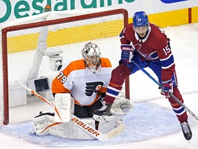 Canadiens centre Jesperi Kotkaniemi tries to set a screen in front of Flyers goalie Carter Hart during third-period   action Tuesday at the Scotiabank Arena in Toronto.