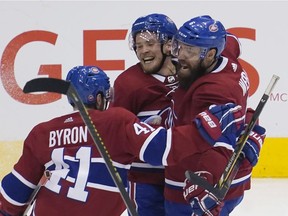Canadiens defenceman Shea Weber (right) and forward Paul Byron (41) congratulates forward Artturi Lehkonen (centre) on scoring the game winning goal against the Pittsburgh Penguins during the third period of Eastern Conference qualifications at Scotiabank Arena on Aug. 7.