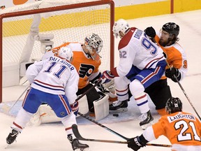 Philadelphia Flyers goaltender Carter Hart makes a save on Canadiens left-wing Jonathan Drouin (92) as Flyers defenceman Ivan Provorov defends during the second period in Game 1 of the first round of the 2020 Stanley Cup Playoffs at Scotiabank Arena in Toronto on Aug. 12, 2020.