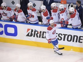 Montreal Canadiens left wing Tomas Tatar (90) slaps hands with the bench after his second period goal against the Philadelphia Flyers in game two of the first round of the 2020 Stanley Cup Playoffs at Scotiabank Arena.