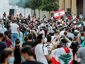 Demonstrators take part in a protest following Tuesday's blast, in Beirut, Lebanon August 9, 2020. REUTERS/Thaier Al-Sudani