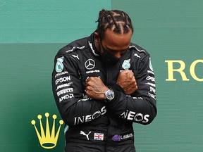 2020 Mercedes' Lewis Hamilton celebrates on the podium after winning the race Pool via REUTERS/Francois Lenoir