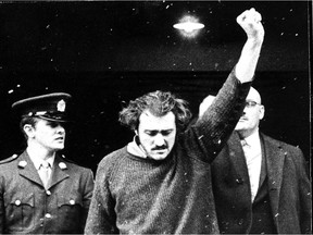 Paul Rose gives a defiant salute as he arrives for a court appearance on Jan. 7, 1971. The film Les Rose was made by his son Félix Rose. Paul Rose died in 2013.