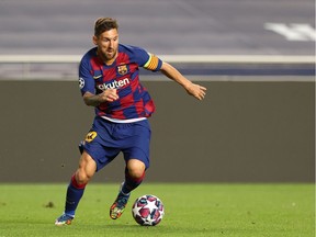 FILE PHOTO: Soccer Football - Champions League - Quarter Final - FC Barcelona v Bayern Munich - Estadio da Luz, Lisbon, Portugal - August 14, 2020  Barcelona's Lionel Messi in action, as play resumes behind closed doors following the outbreak of the coronavirus disease (COVID-19)  REUTERS/Rafael Marchante/Pool/File Photo