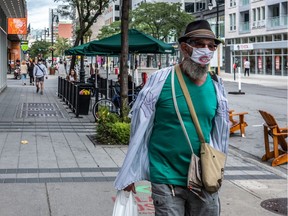 Masks have become de rigueur on Sainte-Catherine Street West in Montreal on Thursday August 20, 2020. Dave Sidaway / Montreal Gazette ORG XMIT: 64893