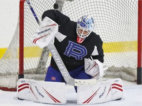 Laval Rocket goalie Michael McNiven makes a save during practice in Laval on March 3, 2020.