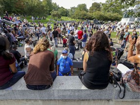People don't social distance around the drum circle at the weekly Tam-Tam festival at the foot of Mount Royal in Montreal on Sept. 6, 2020.