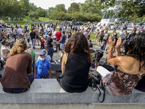 People don't social distance around the drum circle at the weekly Tam-Tam festival at the foot of Mount Royal in Montreal Sunday September 6, 2020.