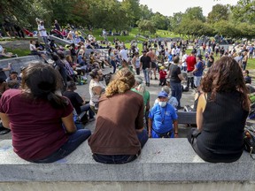 People don't social distance around the drum circle at the weekly Tam-Tams at the foot of Mount Royal in Montreal on Sunday, Sept. 6, 2020.