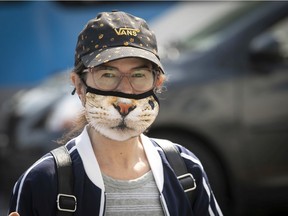 Woman and her cat mask on Parc Ave. at Laurier on Tuesday, September 8, 2020. (Pierre Obendrauf / MONTREAL GAZETTE)