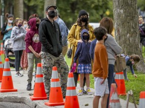 Families wait in line for COVID-19 testing in the Outremont borough Wednesday, September 9, 2020. (John Mahoney / MONTREAL GAZETTE)