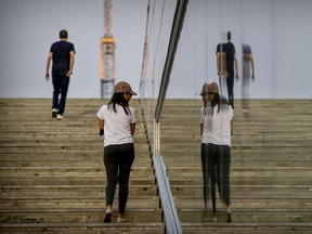 People walk up the stairs at the Grand Quai at the Old Port in Montreal on Sept. 16, 2020.