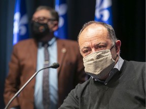 Quebec Health Minister Christian Dubé, right, and Quebec's director of public health, Horacio Arruda, following a news conference on Sunday, Sept. 20, 2020.
