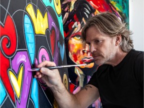 Montreal artist Eric Waugh is seen in his home studio in Dollard-des-Ormeaux on Tuesday.