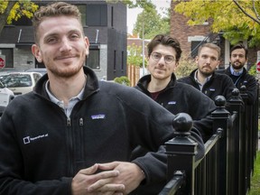Mark Owen, left, with his brother, Jordan (with glasses) and their partners Sean Tassé and Benoit Thibault, far right, outside the offices of squarefeet.ai on Friday, Sept. 25, 2020.