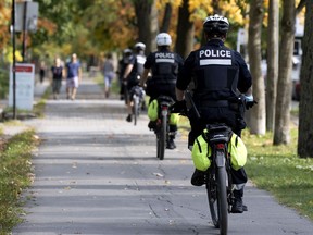 SPVM police bicycle patrols check on the crowds in Parc Lafontaine in Montreal, on Sunday, September 27, 2020.