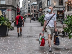 Visitors in Old Montreal are few and far between on St-Paul St. on Monday Sept. 28, 2020.
