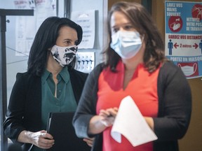 Montreal Mayor Valérie Plante, left, arrives with Montreal public health director Mylène Drouin for a news conference on Tuesday.