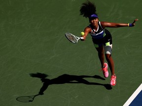 Naomi Osaka of Japan returns a shot during her Women's Singles third round match against Marta Kostyuk of the Ukraine on Day Five of the 2020 U.S. Open at USTA Billie Jean King National Tennis Center on Friday, Sept. 4, 2020, in the Queens borough of New York City.