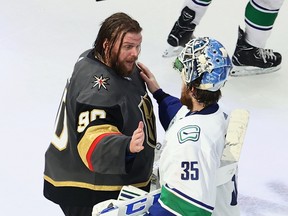 Thatcher Demko (35) of the Vancouver Canucks and Robin Lehner (90) of the Vegas Golden Knights shake following Lehner's 3-0 shutout against Vancouver in Game 7 of the Western Conference second round of the 2020 NHL Stanley Cup Playoffs at Rogers Place on Friday, Sept. 4, 2020.