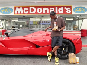 Travis Scott surprises crew and customers at McDonald's for the launch of the Travis Scott Meal on September 08, 2020 in Downey, California.