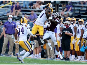 Eli Ricks (1) of the LSU Tigers intercepts a pass over JaVonta Payton (0) of the Mississippi State Bulldogs during a NCAA football game at Tiger Stadium on Saturday, Sept. 26, 2020, in Baton Rouge.