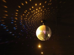 A disco ball at a karaoke lounge.