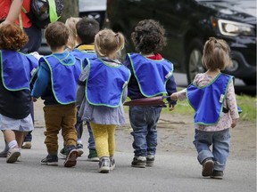 Daycare children walk down a street in the Plateau Mont-Royal district in Montreal on Sept. 2, 2020.