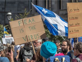 Thousand of demonstrators protested against the Quebec government's mandatory mask law in Montreal on Saturday September 12, 2020. The crowd was made up of anti-mask supporters, anti-vaxxers, Quebec independence, Trump and QAnon supporters.