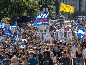 Thousand of demonstrators protested peacefully against the Quebec government's mandatory mask law in Montreal on Saturday, Sept. 12, 2020.