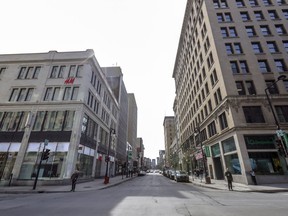 The corner of Peel and Ste-Catherine Sts. is seen in the middle of a weekday in March 2020.