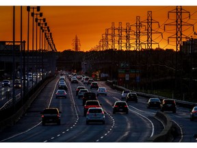 Traffic heads through Dorval on Highway 20 at sunset in Montreal Thursday September 17, 2020.
