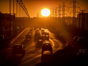 Traffic heads through Dorval on Highway 20 at sunset in Montreal Thursday September 17, 2020.