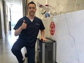 Orthodontist Dr. Giovanni Scalia, with an Aerus air purifier.