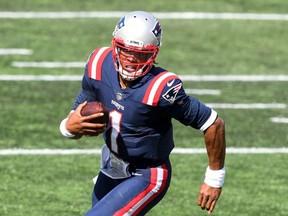 New England Patriots quarterback Cam Newton runs for a touchdown against the Miami Dolphins during the third quarter at Gillette Stadium in Foxborough, Mass., on Sunday, Sept. 13, 2020.