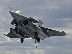 This file photo taken on February 10, 2020 shows a French Rafale fighter jet approaching to the French aircraft carrier, Charles de Gaulle, off the eastern coast of Cyprus in the Mediterranean Sea.