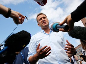 Russian opposition leader Alexei Navalny is seen speaking with journalists in Moscow on July 20, 2019.
