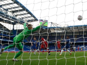 Liverpool's striker Sadio Mane (C) heads the ball to score past Chelsea's goalkeeper Kepa Arrizabalaga during the English Premier League football match between Chelsea and Liverpool at Stamford Bridge in London on Sept. 20. The social media reaction was predictable.