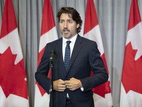 Prime Minister Justin Trudeau speaks with the media before the first day of a Liberal cabinet retreat in Ottawa, Monday September 14, 2020.